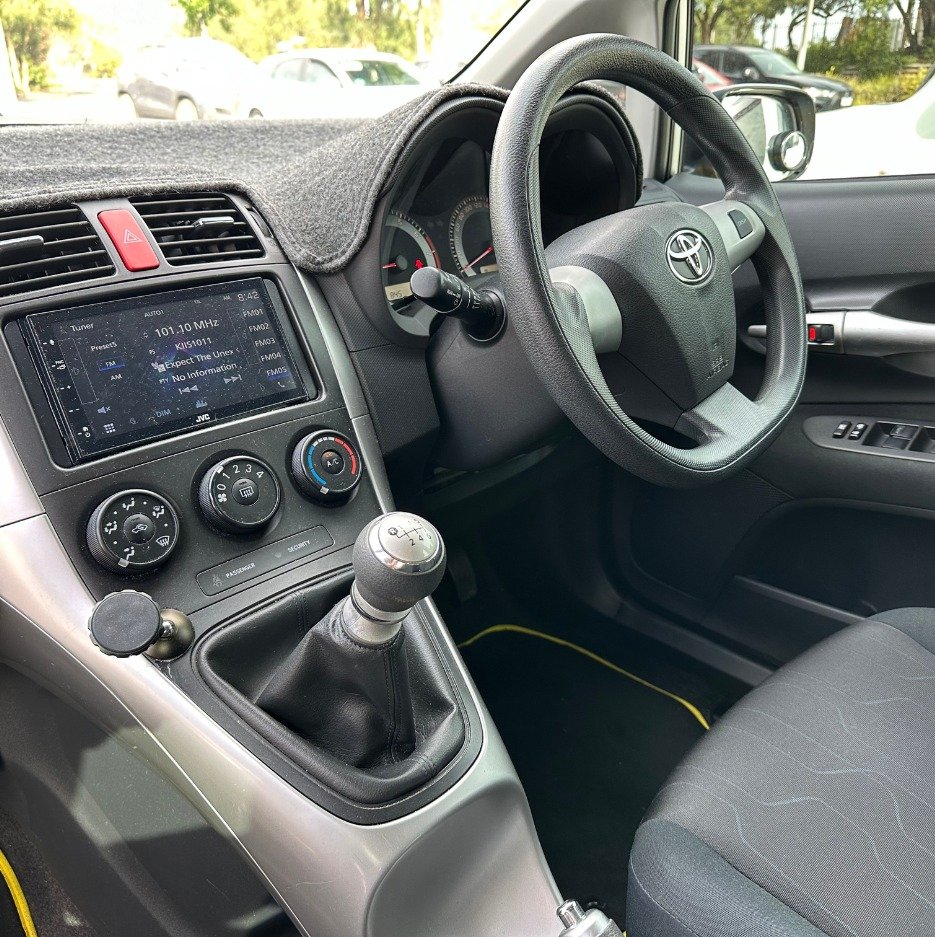 Manual gear stick and right-hand-drive controls in a WDS training vehicle